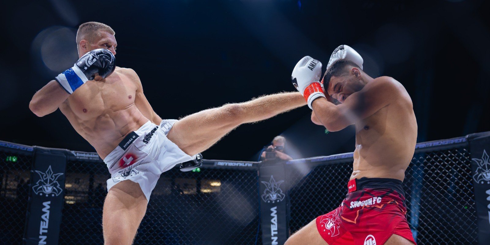 MMA fighter performing a high kick against opponent in octagon during professional mixed martial arts match